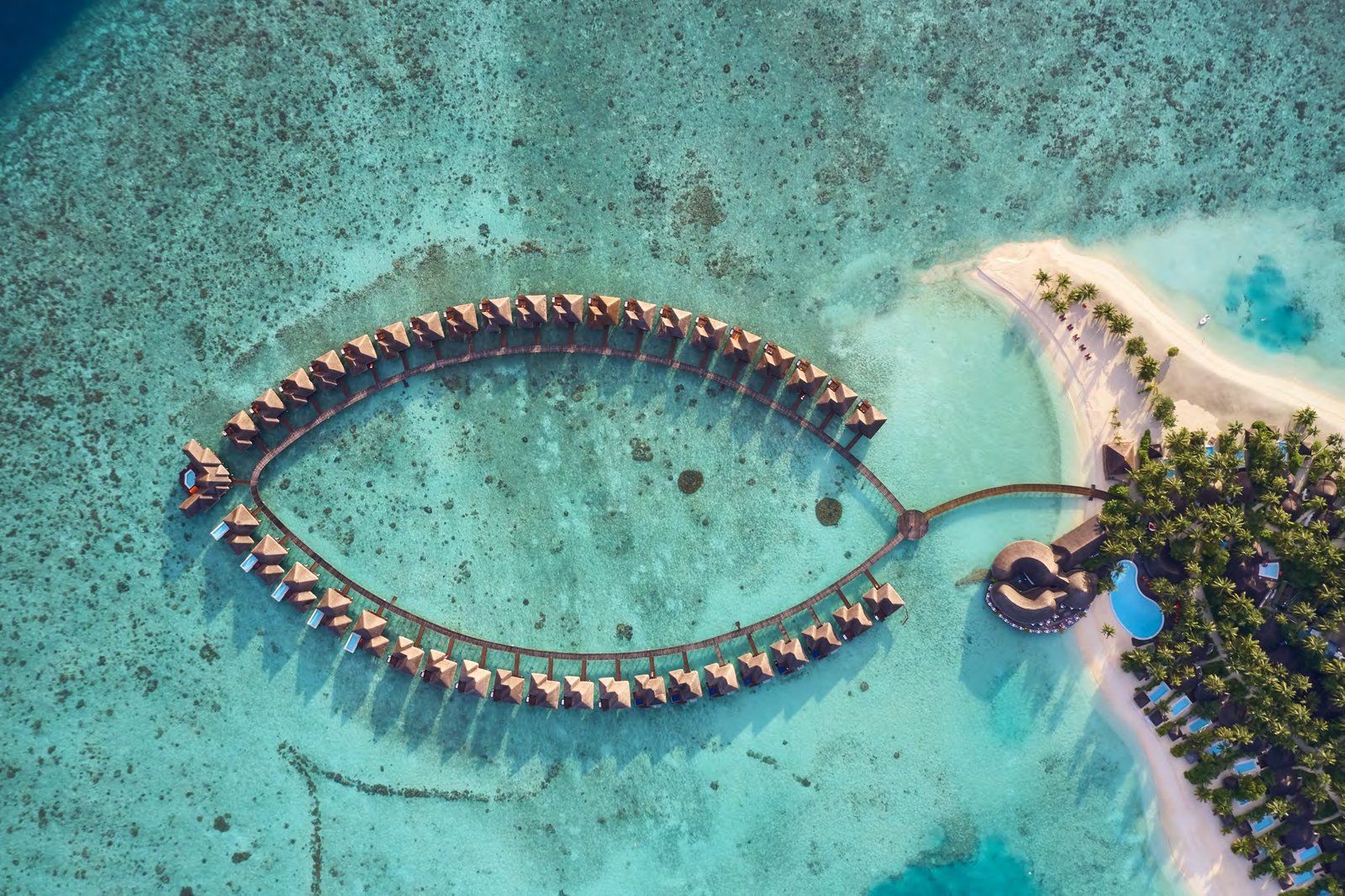Aerial view of Sun Siyam Vilu Reef's overwater villa loop, Dhaalu Atoll, Maldives