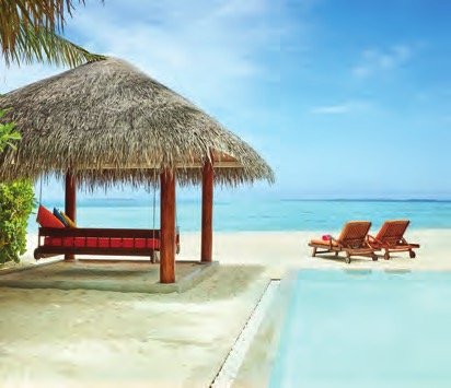 Beachfront cabana and pool at Sun Siyam Vilu Reef, Maldives