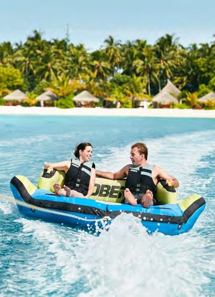 Guests enjoying tube watersports, Sun Siyam Vilu Reef, Maldives