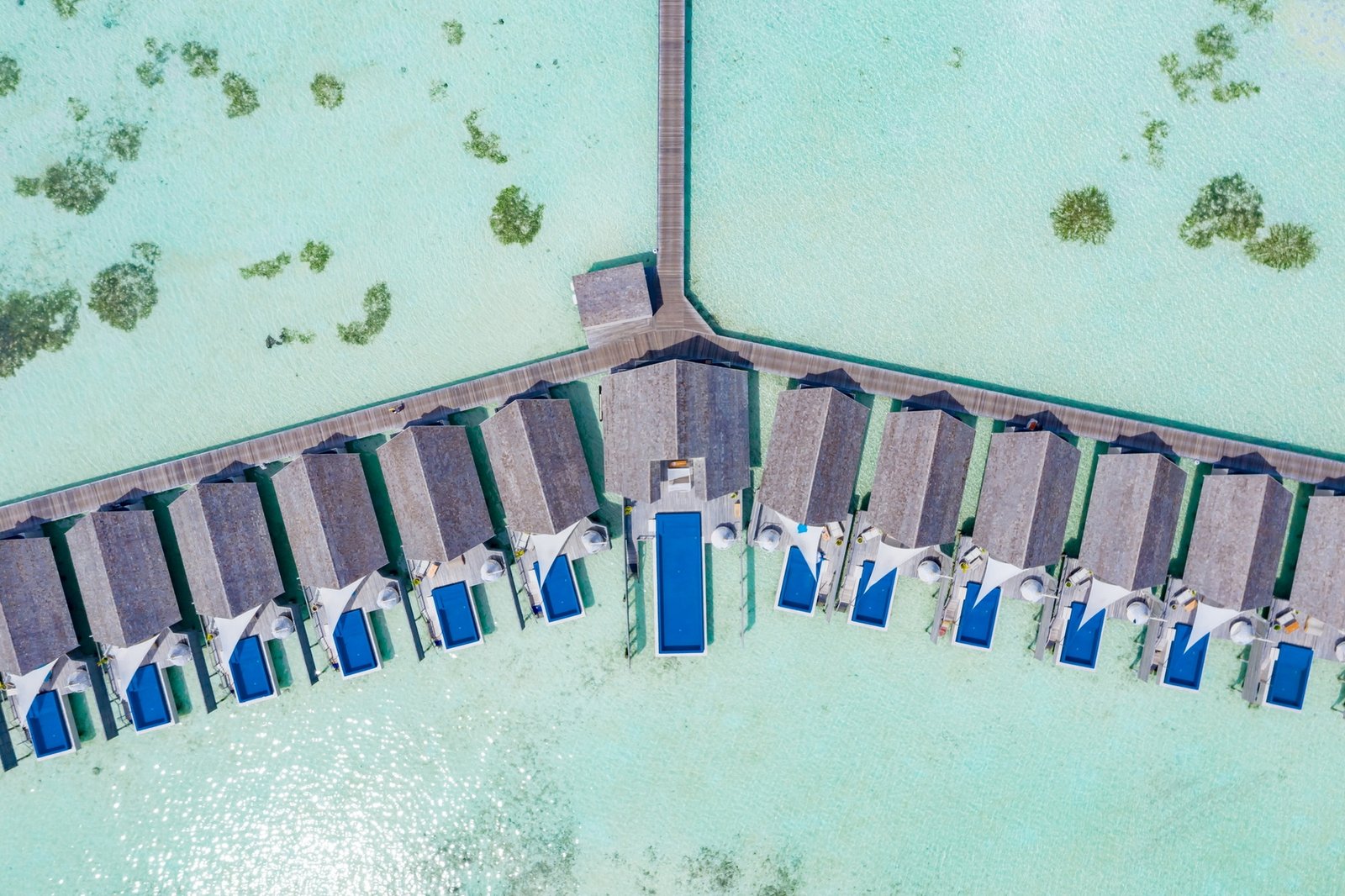 Lagoon and overwater villa jetty at LUX* South Ari Atoll, South Ari Atoll