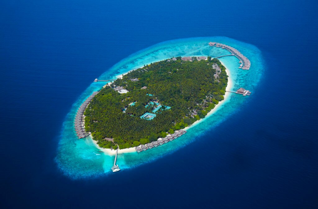 Dusit Thani Maldives hero — aerial view of the island, Baa Atoll, Maldives