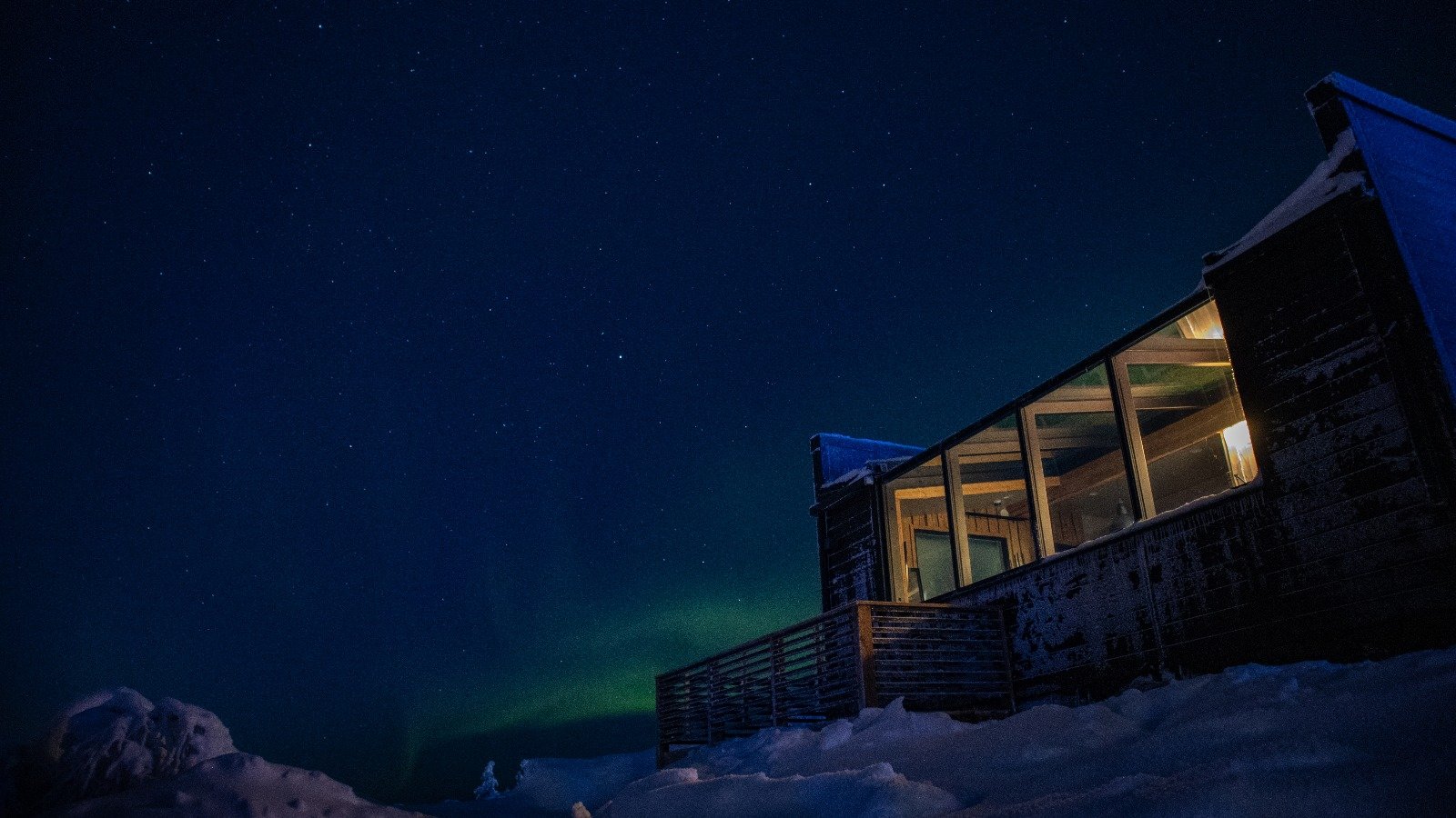 Aurora borealis over a cabin, Northern Lights Village Saariselkä