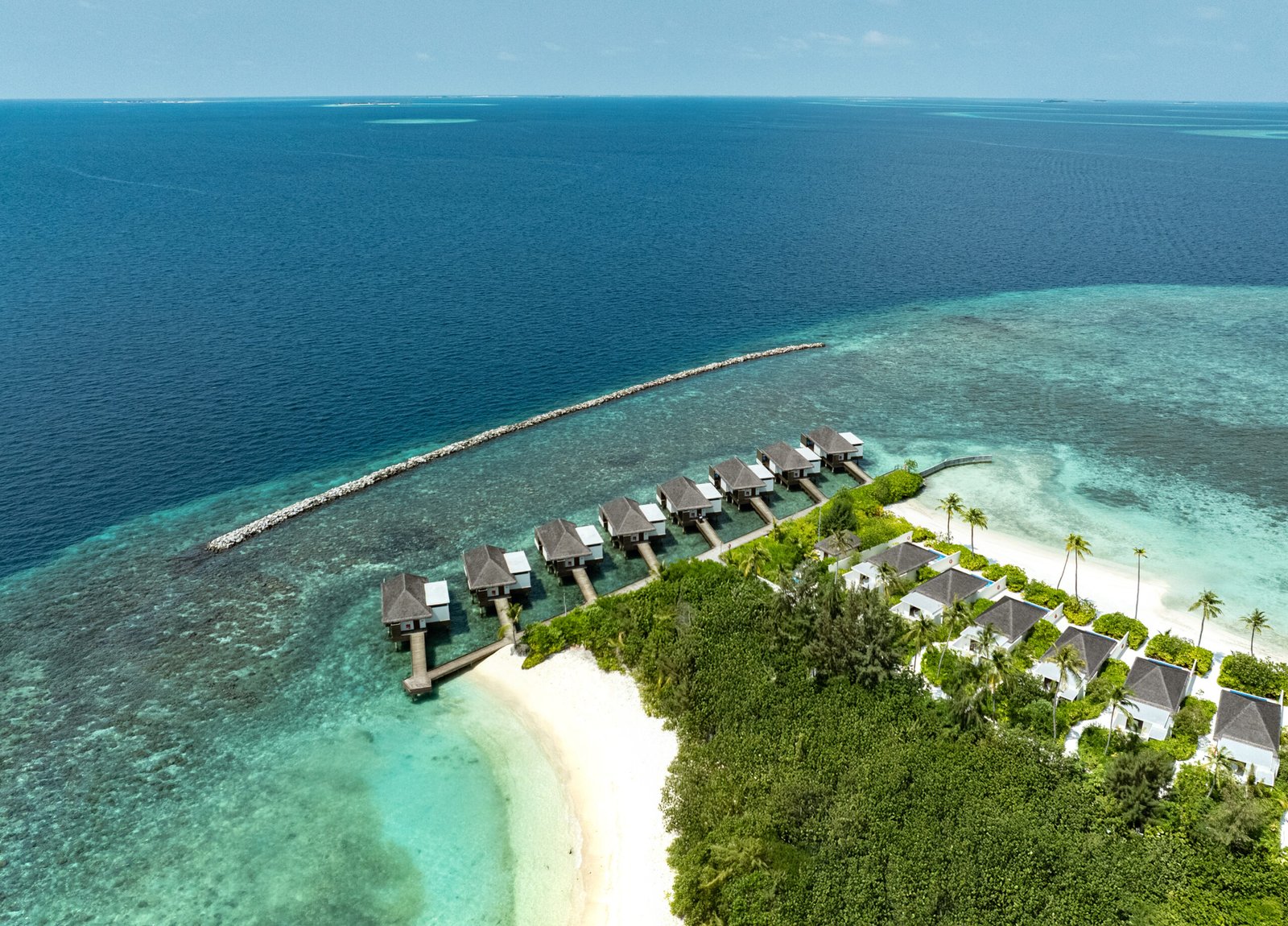 Aerial view of the house reef edge and lagoon at dusitD2 Feydhoo Maldives, North Malé Atoll