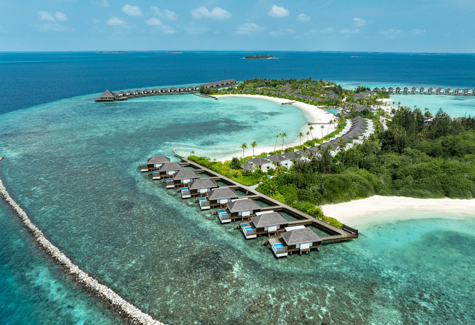 Aerial view of overwater villas and beach at dusitD2 Feydhoo Maldives, North Malé Atoll