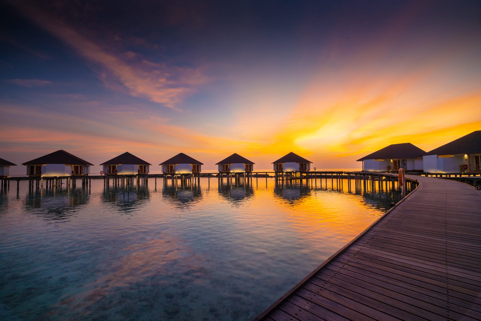 Water Bungalow exterior at sunset, Ellaidhoo Maldives by Cinnamon