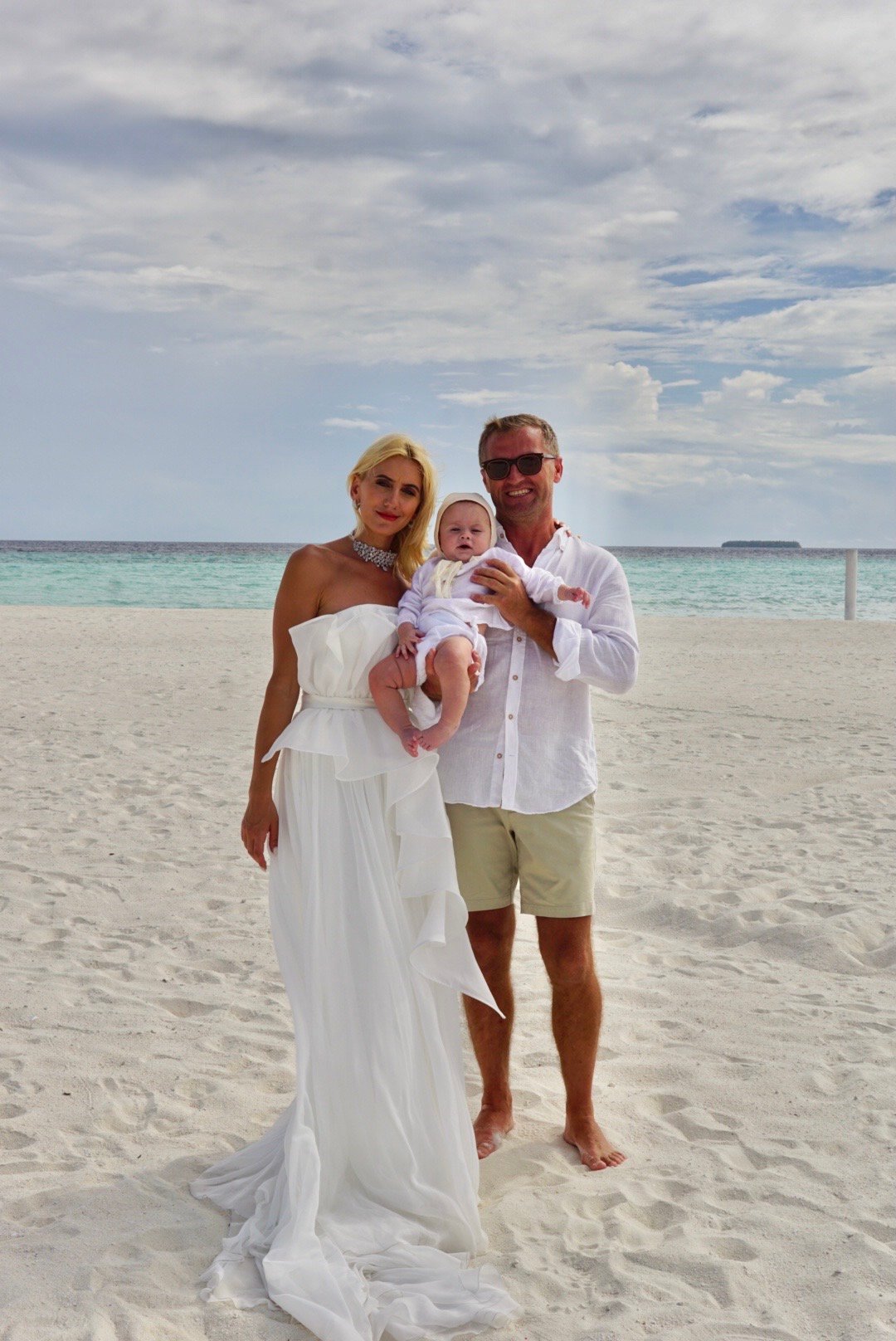 Family enjoying Dhigufaru Island Resort, Maldives