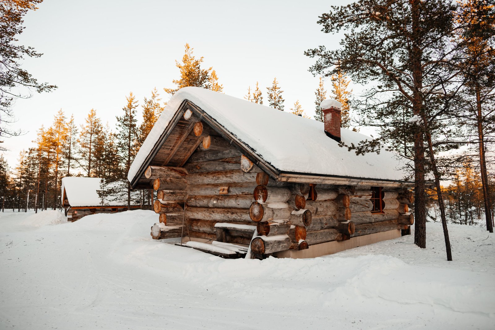 Gold Digger Cabin exterior on the bank of Gold Creek, Kakslauttanen Arctic Resort