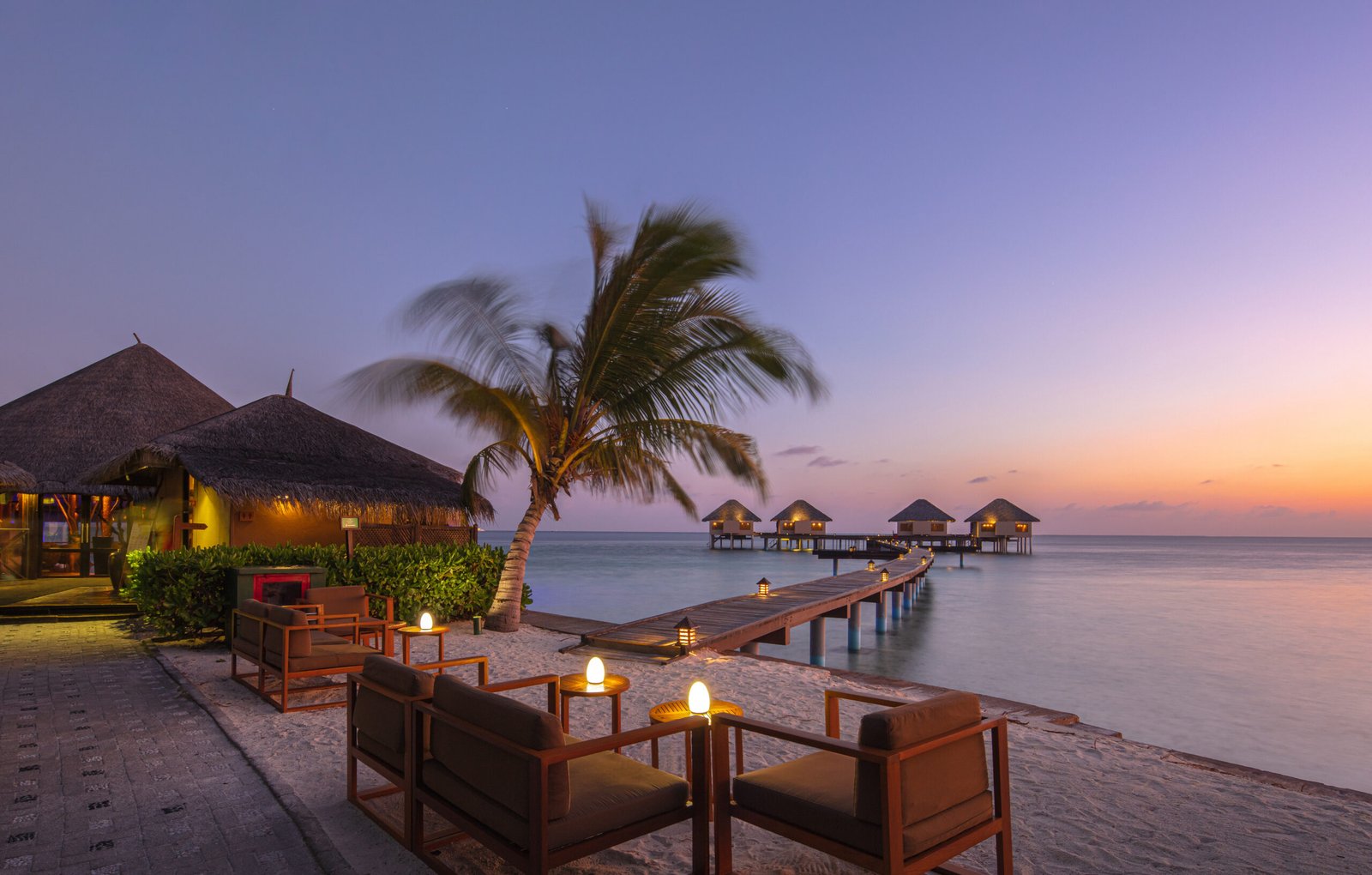 Overwater villa walkway at dusk, Adaaran Prestige Vadoo, South Malé Atoll
