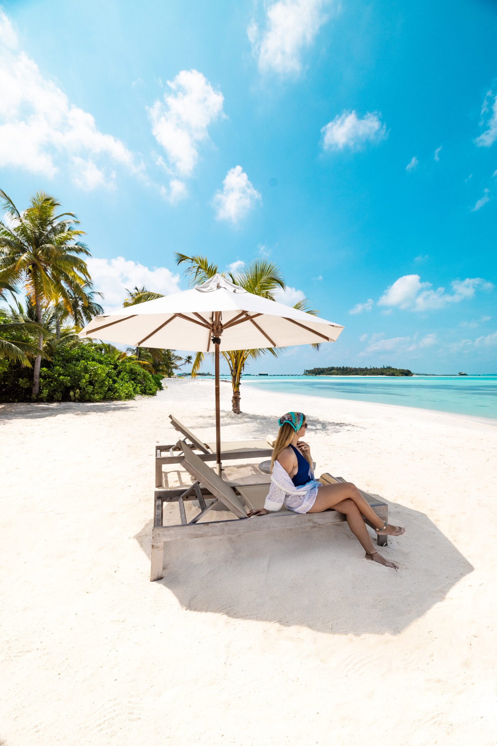 Beach loungers under a shade umbrella at Nala Maldives by Jawakara, Lhaviyani Atoll