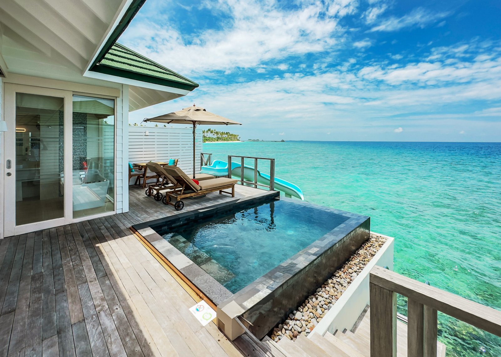 Lagoon and reef view from an overwater villa deck, Siyam World, Noonu Atoll