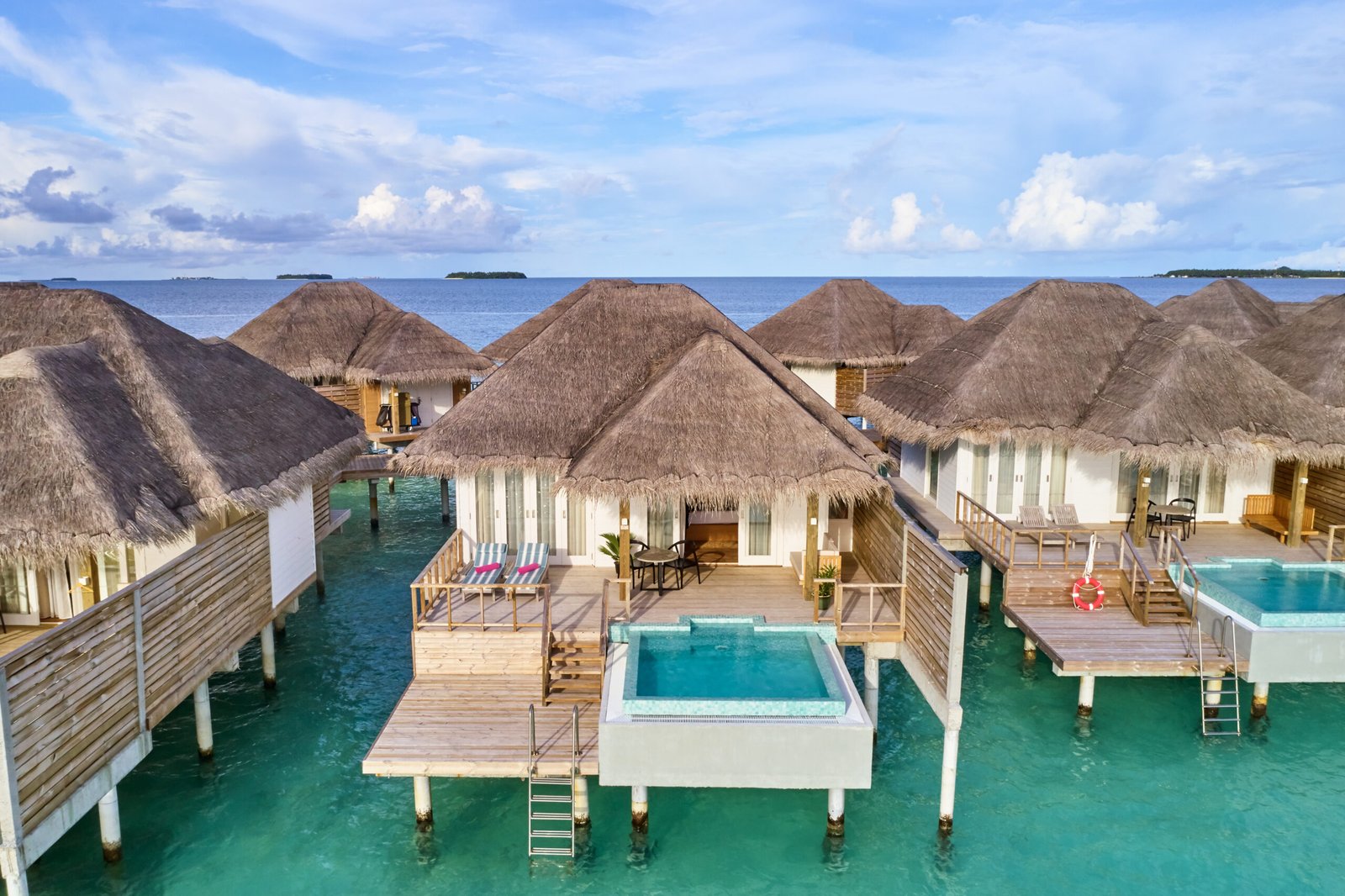 Aerial view of overwater pool villas over the lagoon, Sun Siyam Iru Veli, Dhaalu Atoll