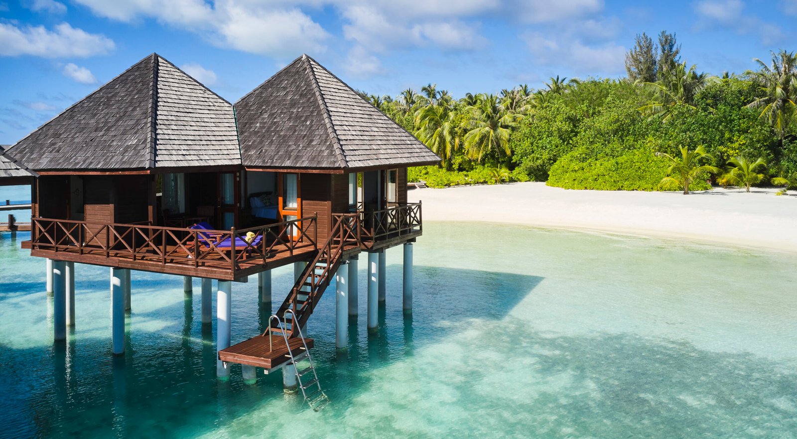Water Villa exterior with beach backdrop, Sun Siyam Olhuveli, Maldives