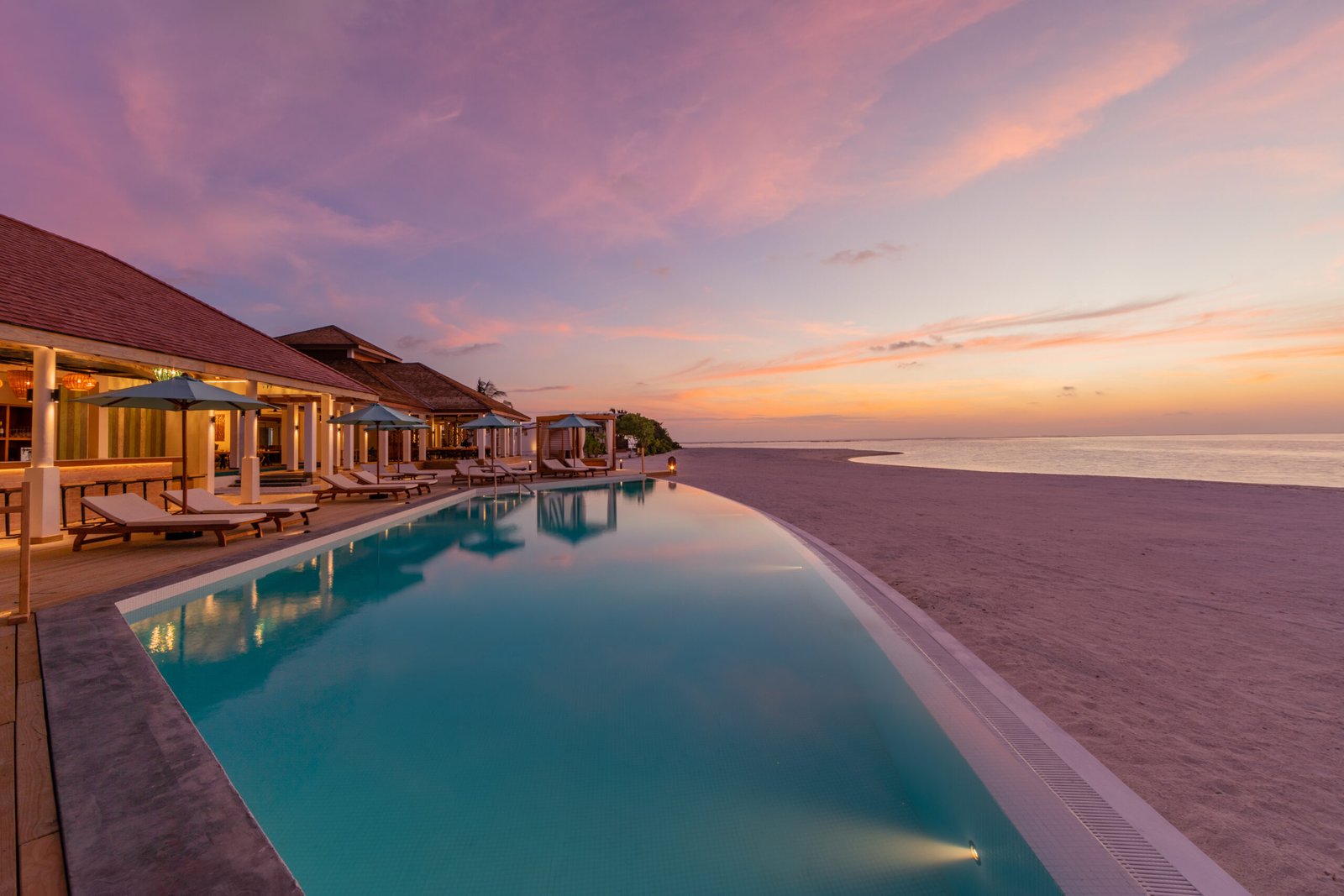 Lagoon and sandbank view from the Platinum Island pool deck at dusk, Cinnamon Hakuraa Huraa Maldives