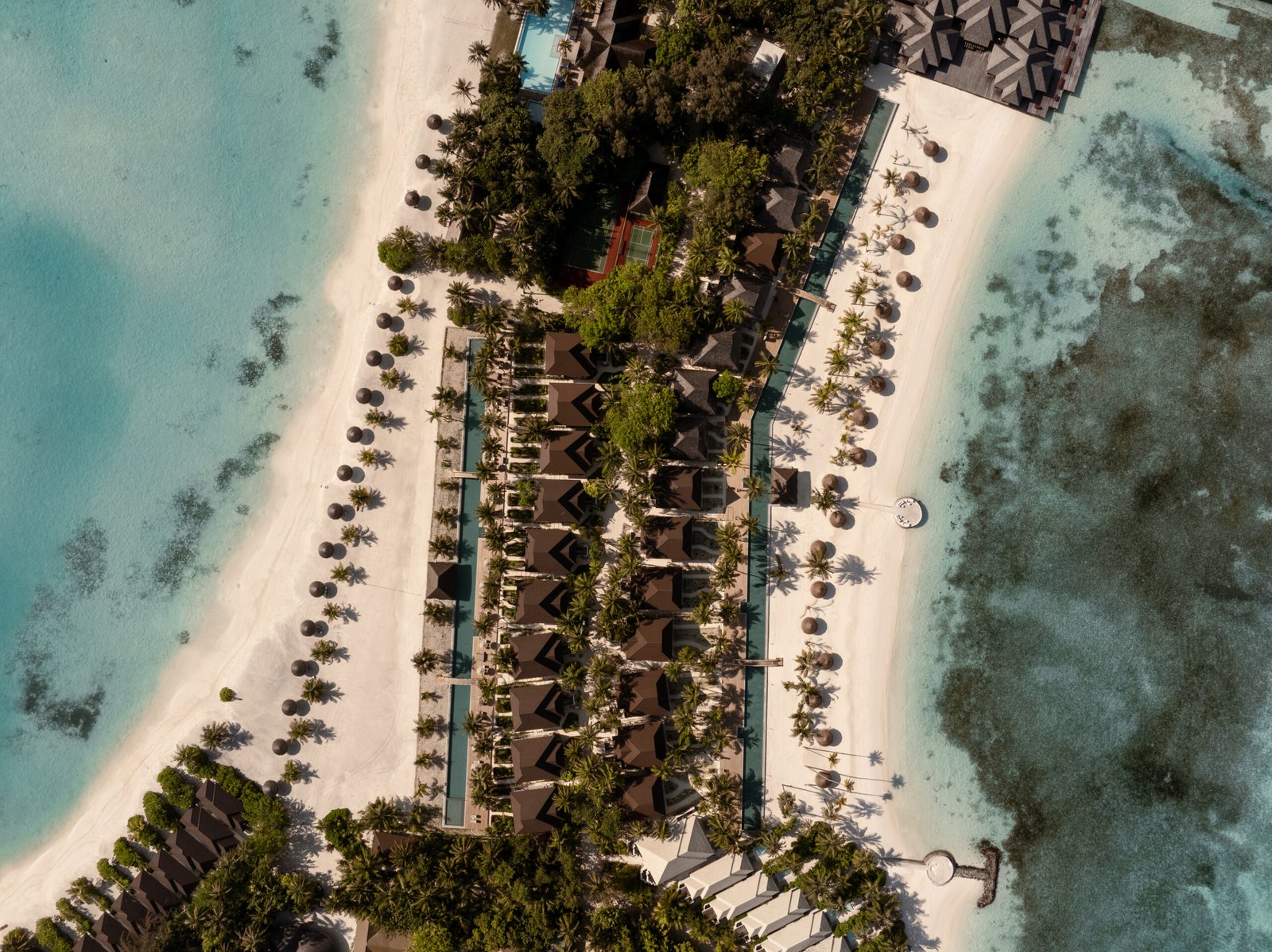 Aerial view of Beach Pavilion villas, plunge pool and white-sand beach at Sun Siyam Olhuveli, Maldives