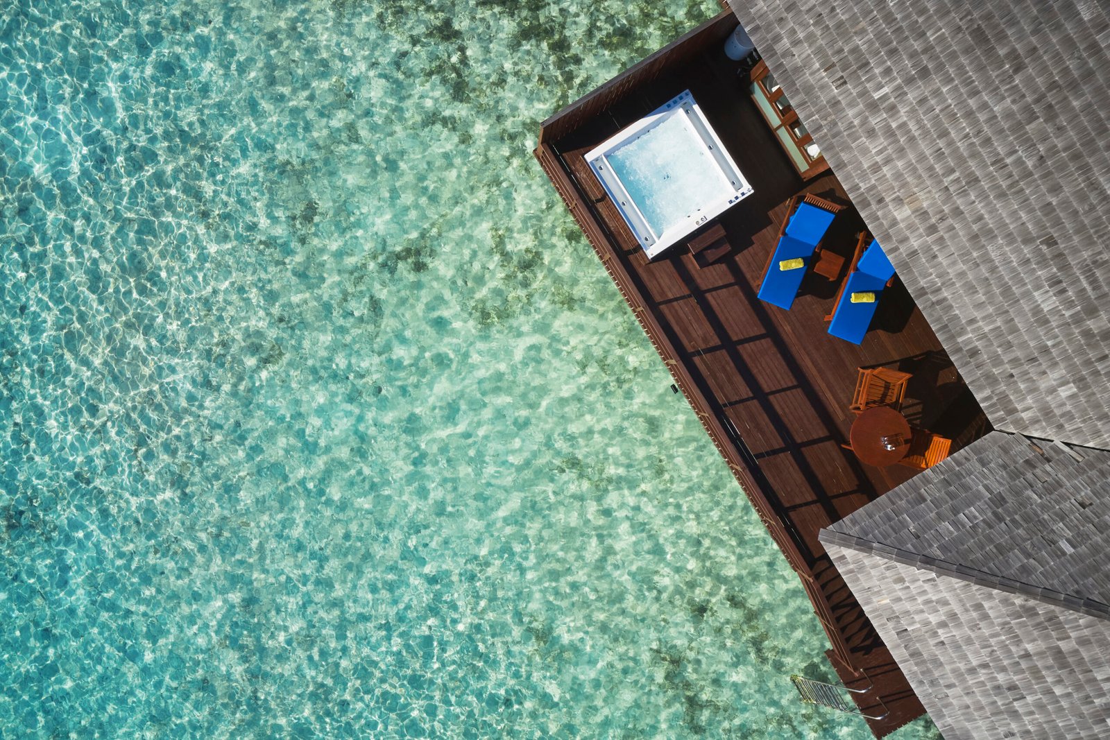 Overwater villa deck and jacuzzi above the lagoon, Sun Siyam Olhuveli, Maldives