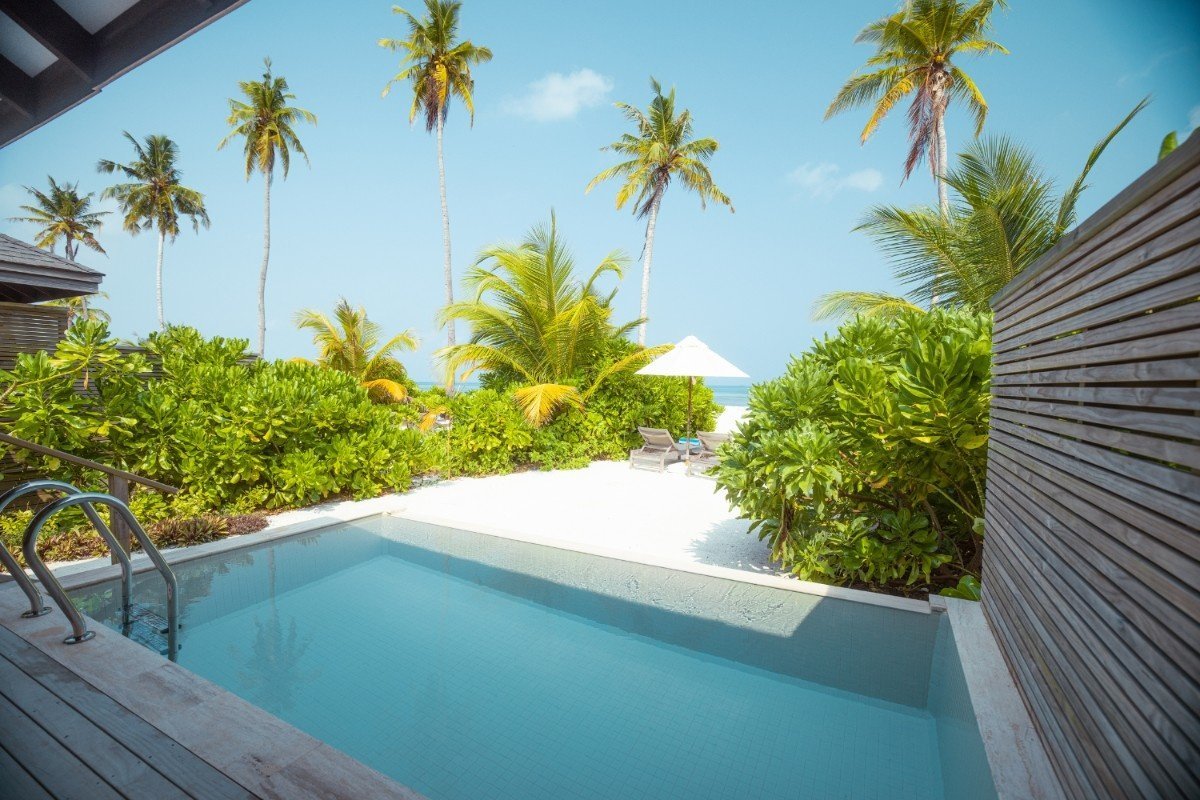 Villa private plunge pool with beach and lagoon view, Jawakara Islands Maldives