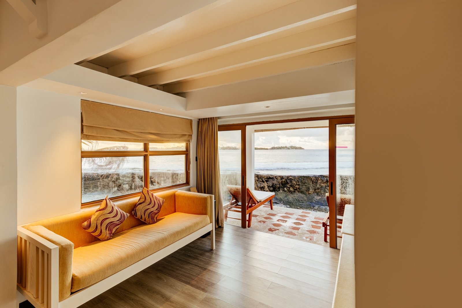 Sitting area of the Duplex Garden Bungalow looking out to the water, Cinnamon Dhonveli Maldives