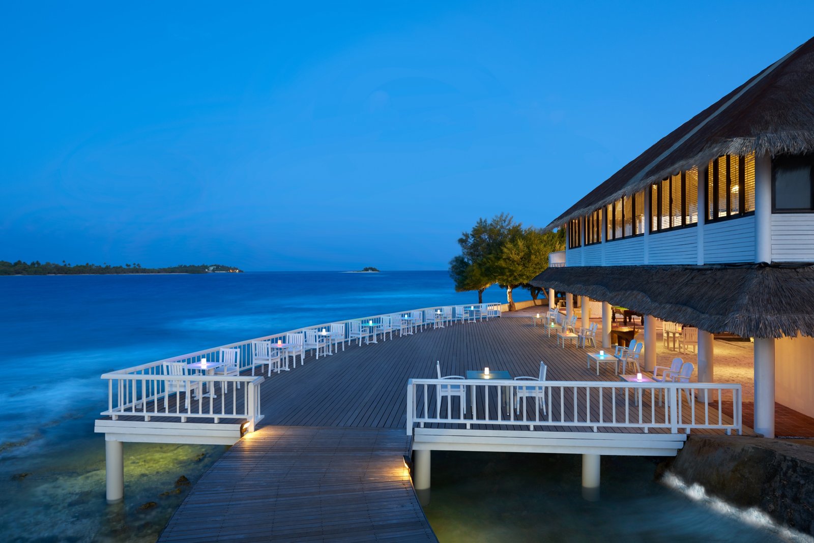 Raalhu Bar deck at dusk over the reef edge, Cinnamon Dhonveli Maldives
