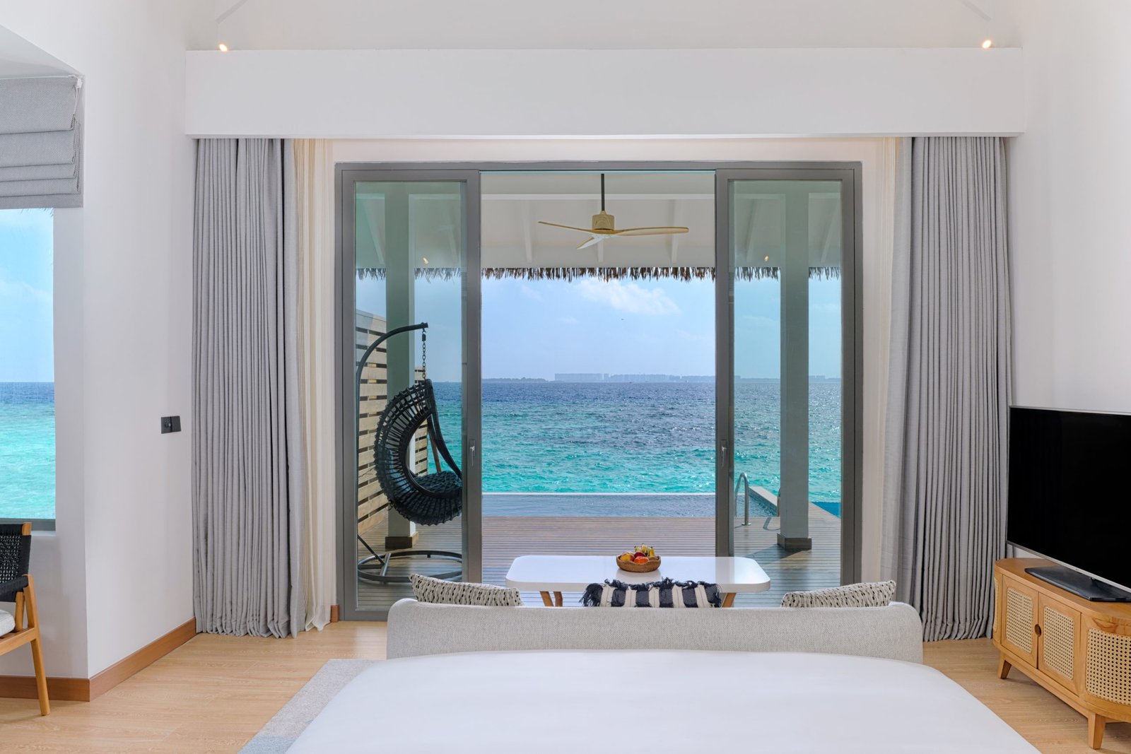 dusitd2-feydhoo-maldives-accommodation-overwater-pool-villa-bedroom-view-scaled