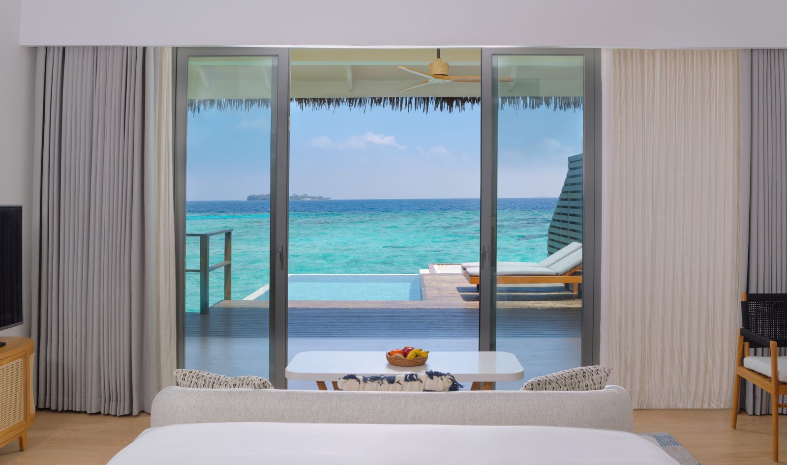 dusitd2-feydhoo-maldives-accommodation-waterfront-pool-villa-bedroom-pool-view-scaled