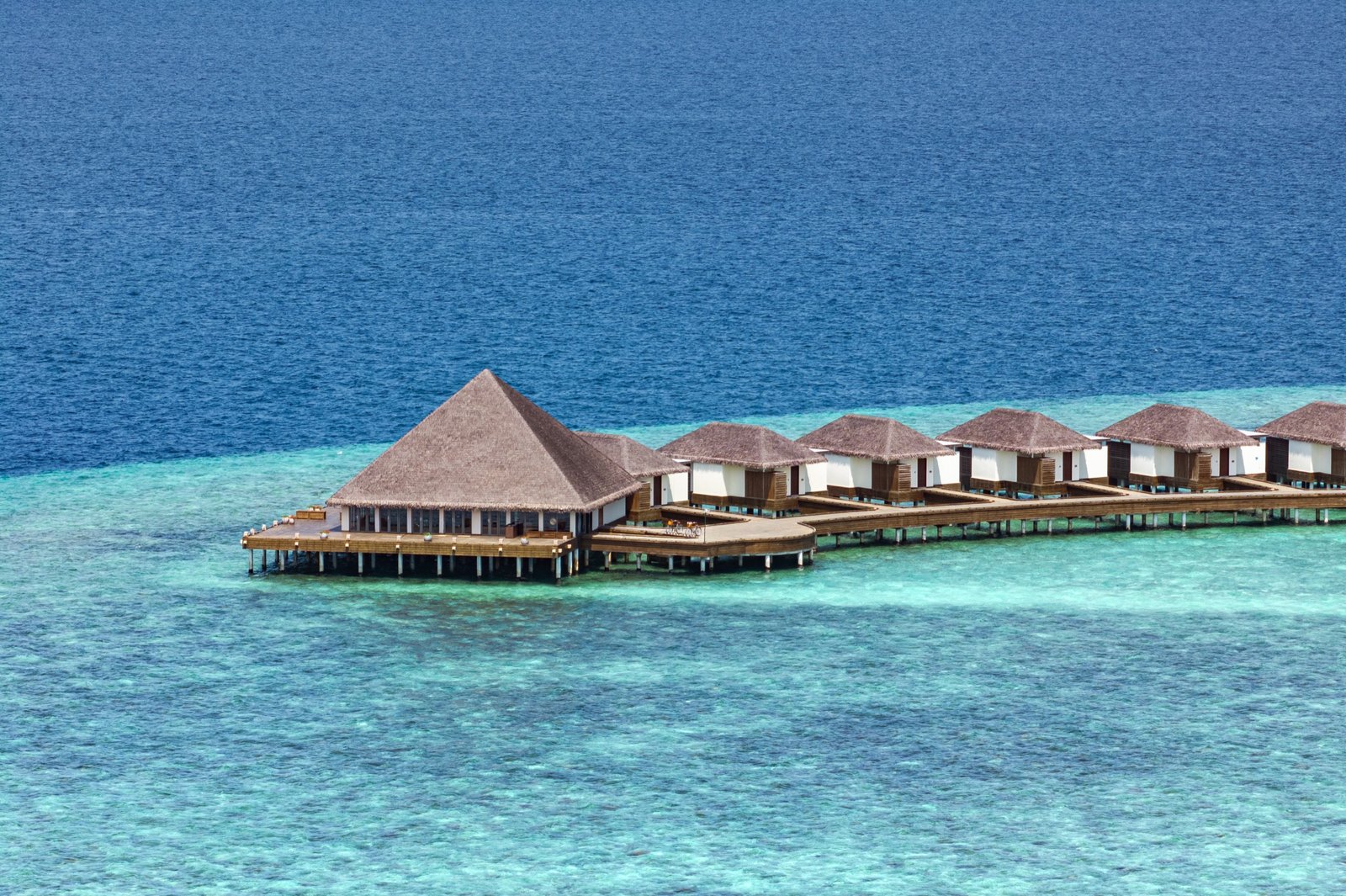 Overwater pool villa arm over the reef edge, dusitD2 Feydhoo Maldives
