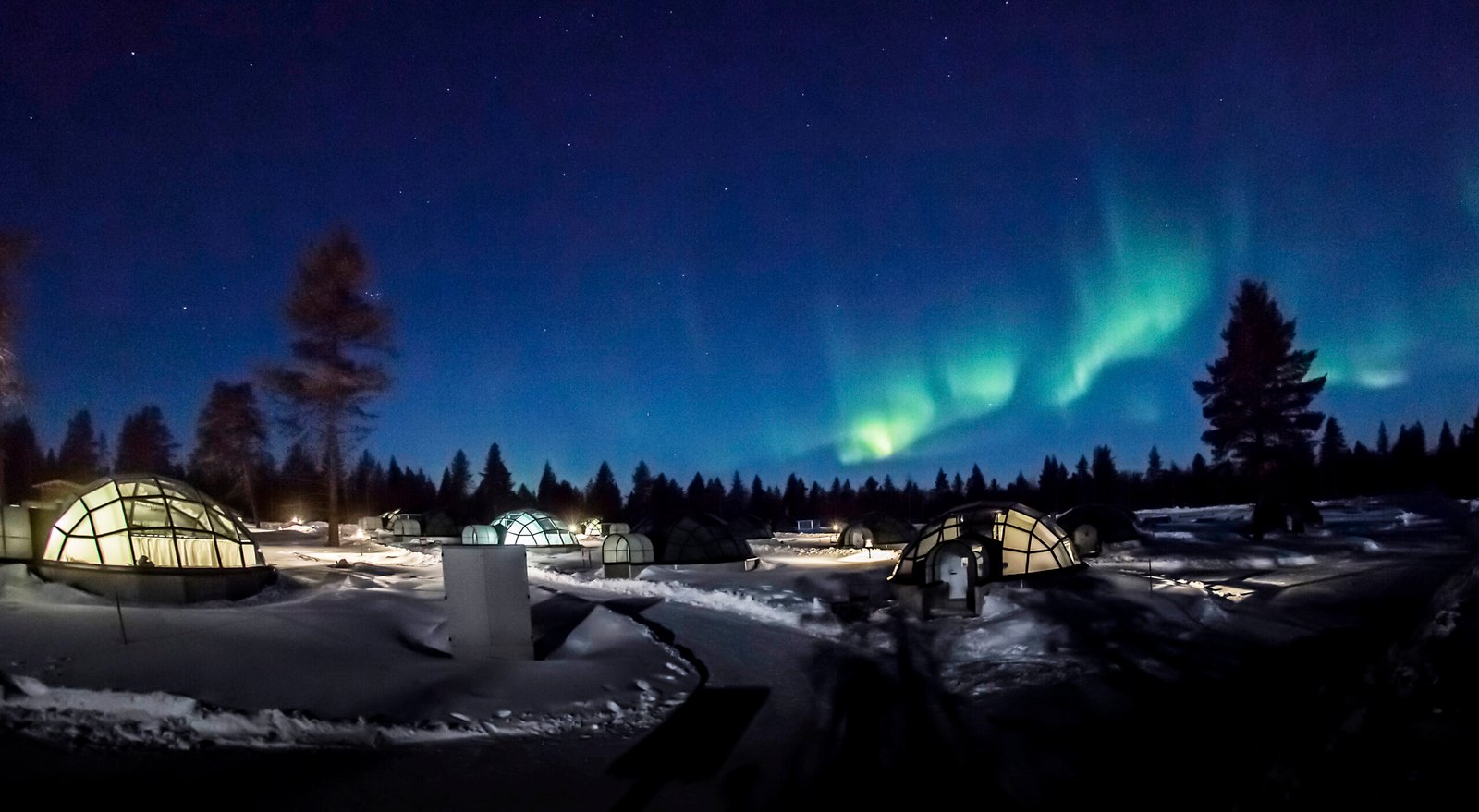 Northern Lights over the glass igloos, Kakslauttanen Arctic Resort