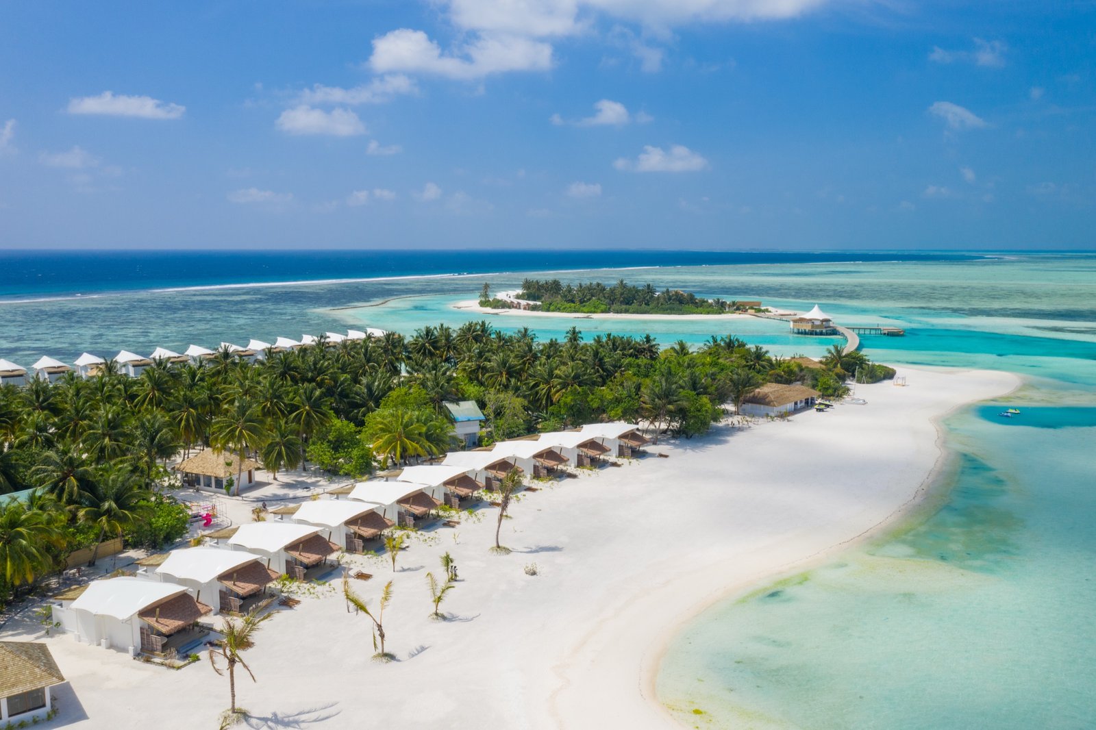 Beach Bungalow row along the main-island beach, with Platinum Island beyond, Cinnamon Hakuraa Huraa Maldives