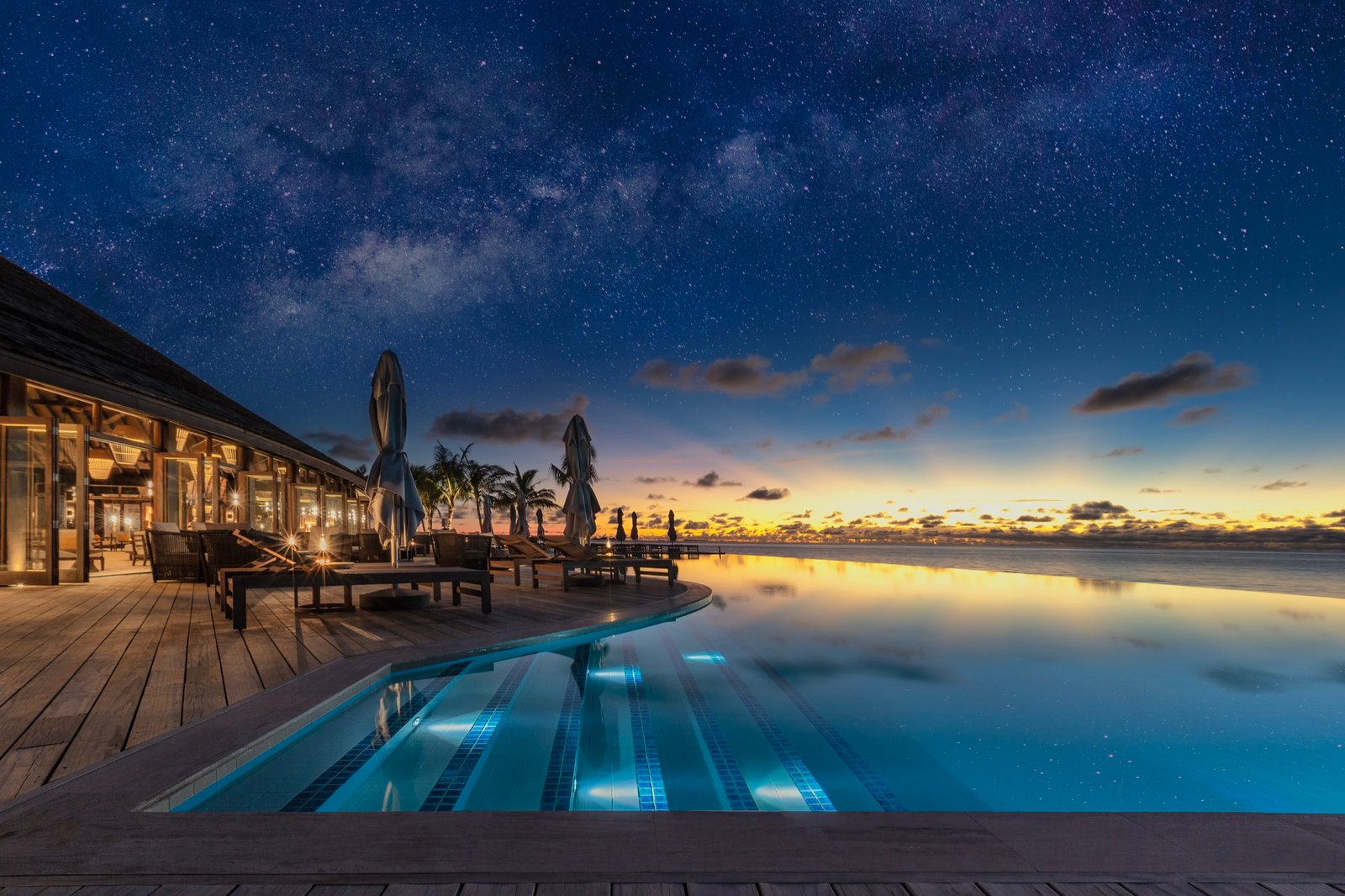 Bonthi Bar pool deck under the night sky, Jawakara Islands Maldives