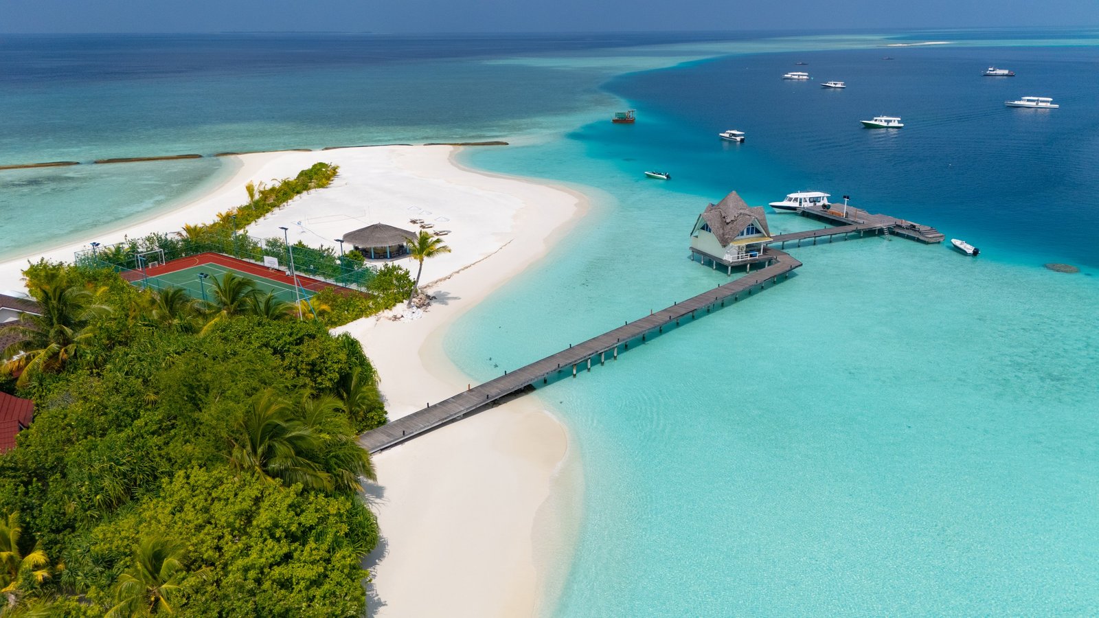 The arrival jetty running out to the arrival pavilion at Dhigufaru Island Resort, Baa Atoll