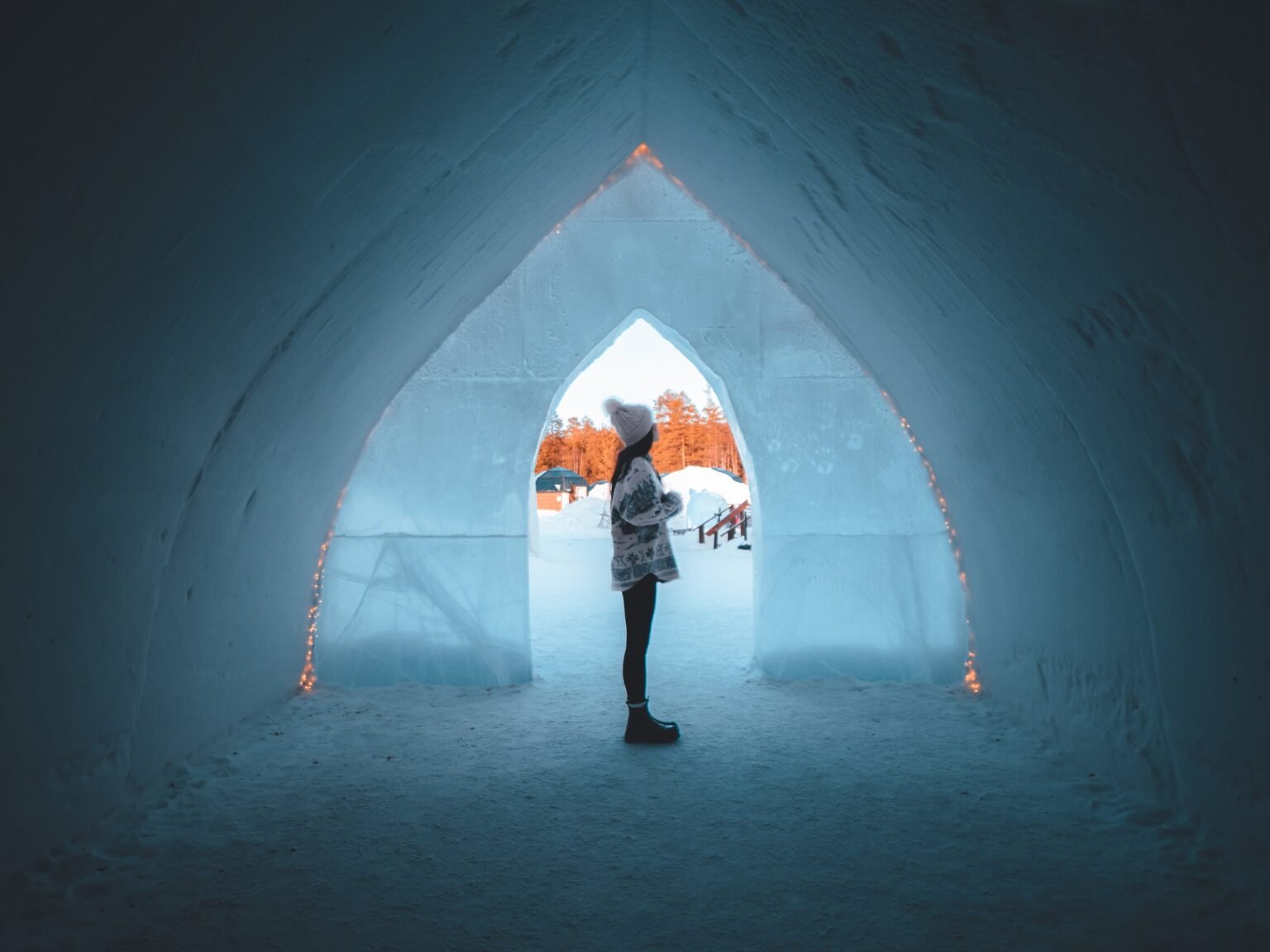 Visitors inside the snow hotel — Arctic SnowHotel & Glass Igloos, Sinettä, Rovaniemi