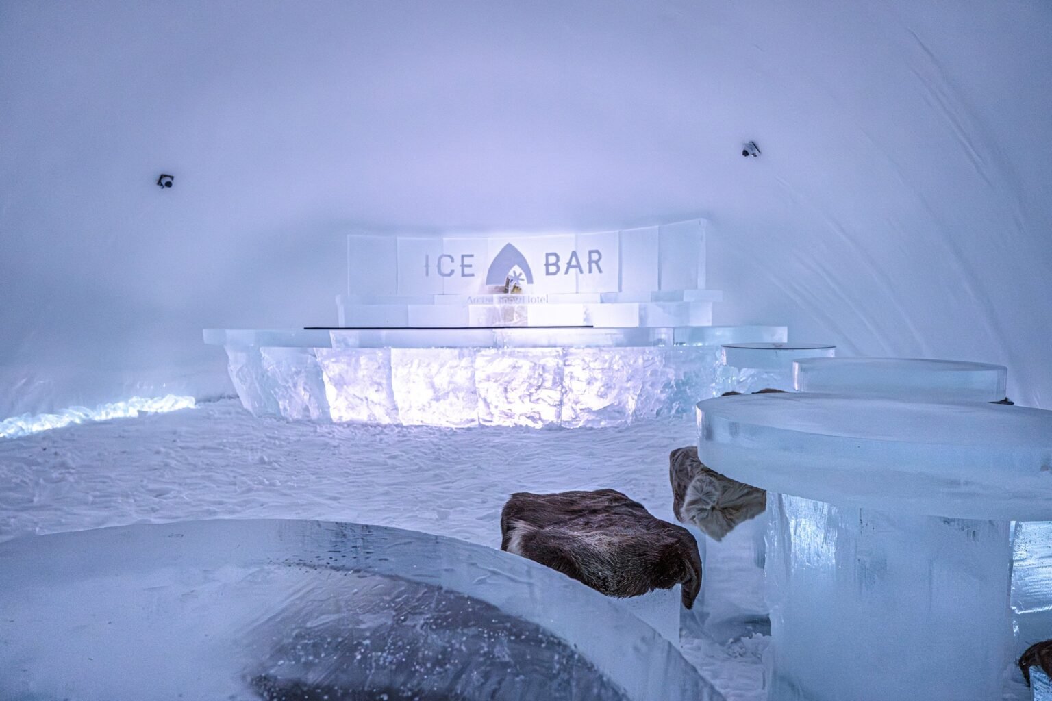 The Ice Bar, where drinks are served in glasses made of ice — Arctic SnowHotel & Glass Igloos, Sinettä, Rovaniemi