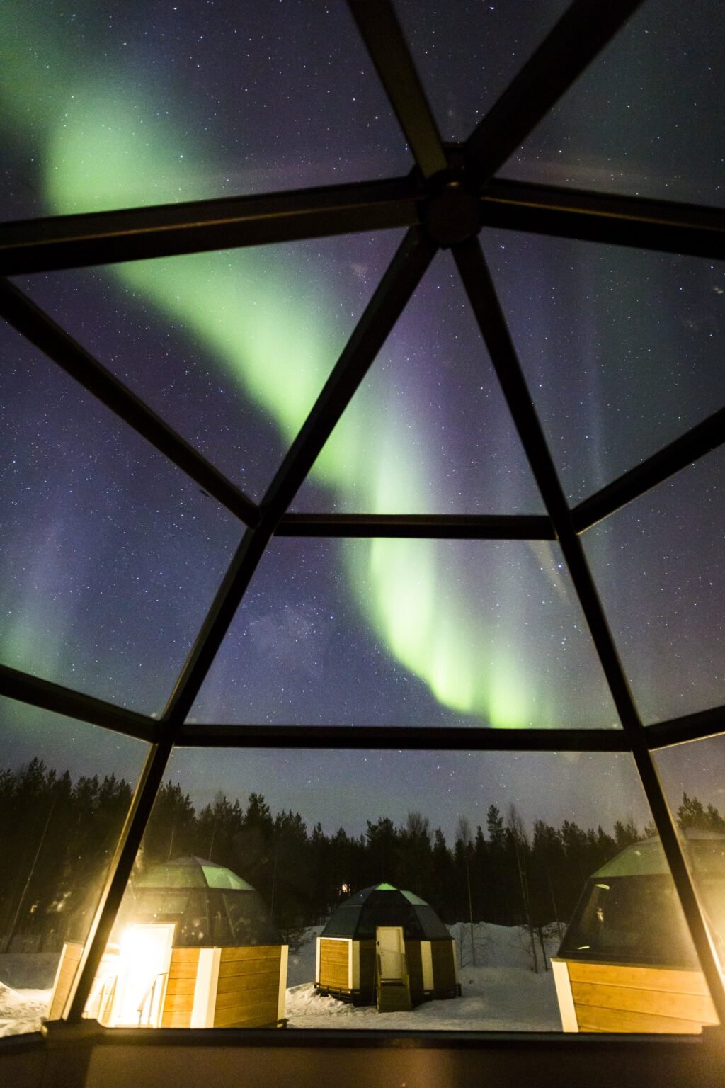 A heated glass igloo under the night sky — Arctic SnowHotel & Glass Igloos, Sinettä, Rovaniemi