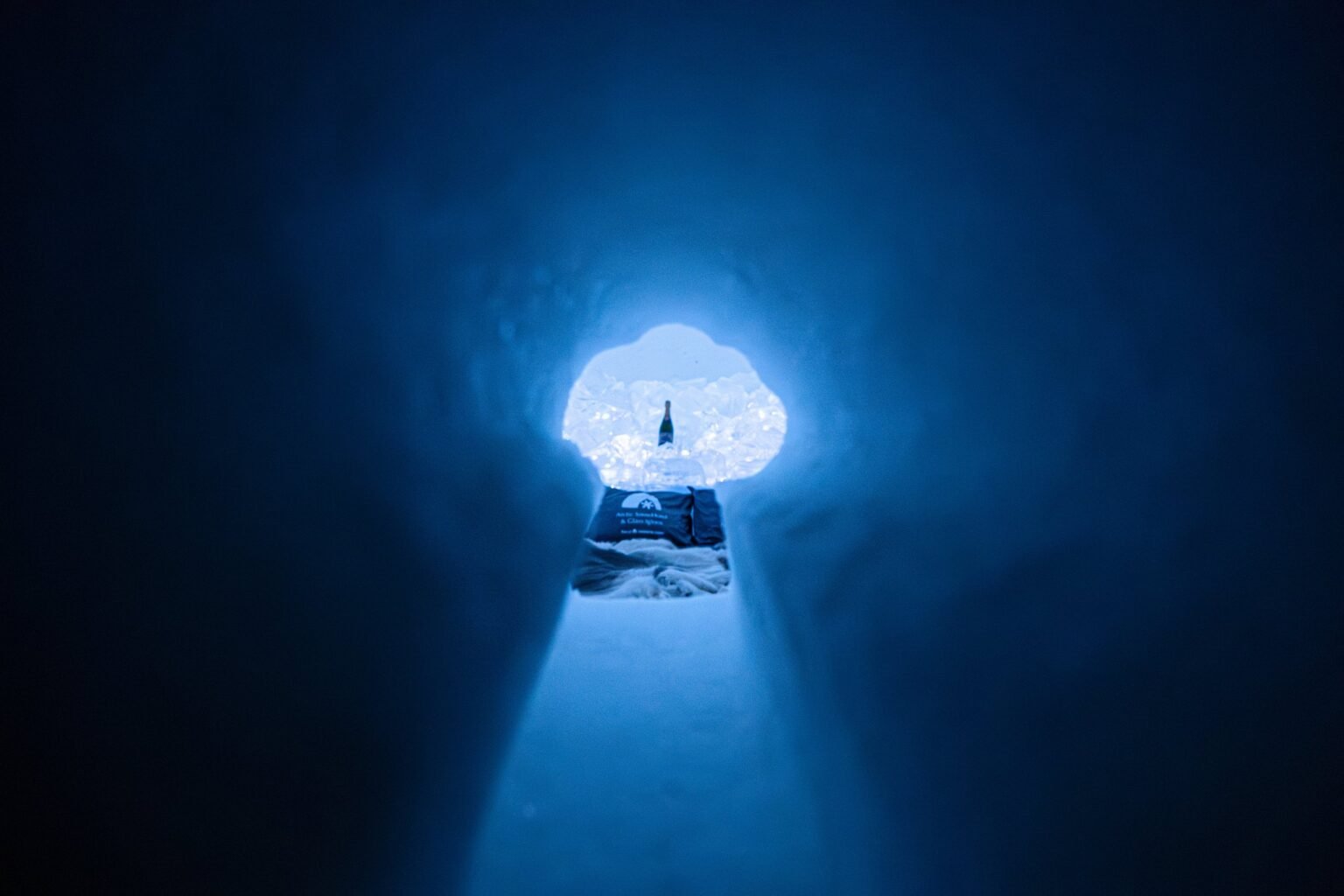A room carved from snow, kept between 0 and −5 °C — Arctic SnowHotel & Glass Igloos, Sinettä, Rovaniemi