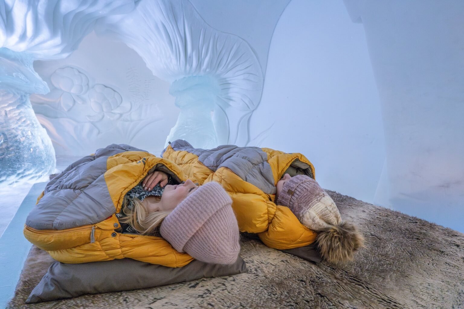 A room carved from snow, kept between 0 and −5 °C — Arctic SnowHotel & Glass Igloos, Sinettä, Rovaniemi