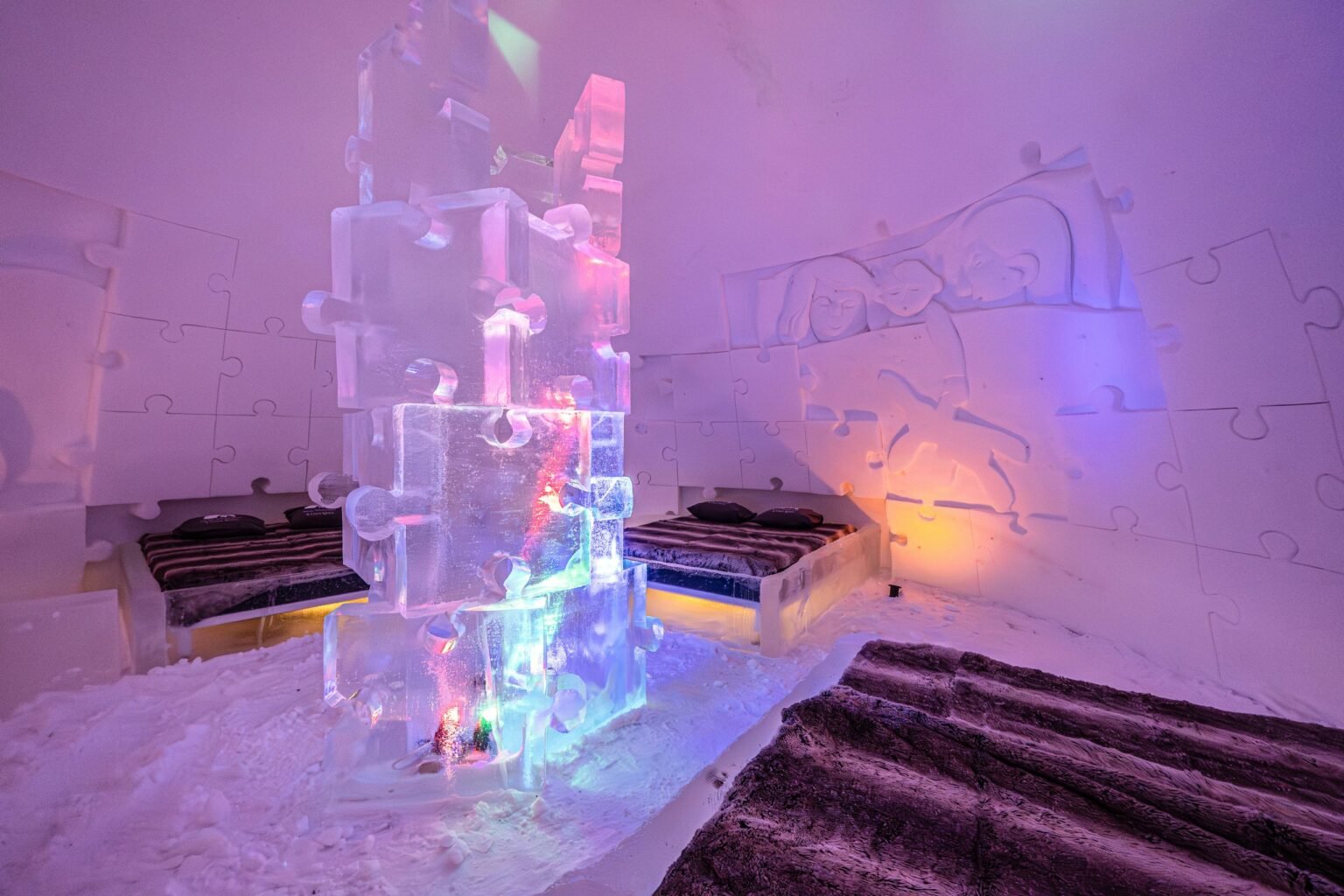 A room carved from snow, kept between 0 and −5 °C — Arctic SnowHotel & Glass Igloos, Sinettä, Rovaniemi