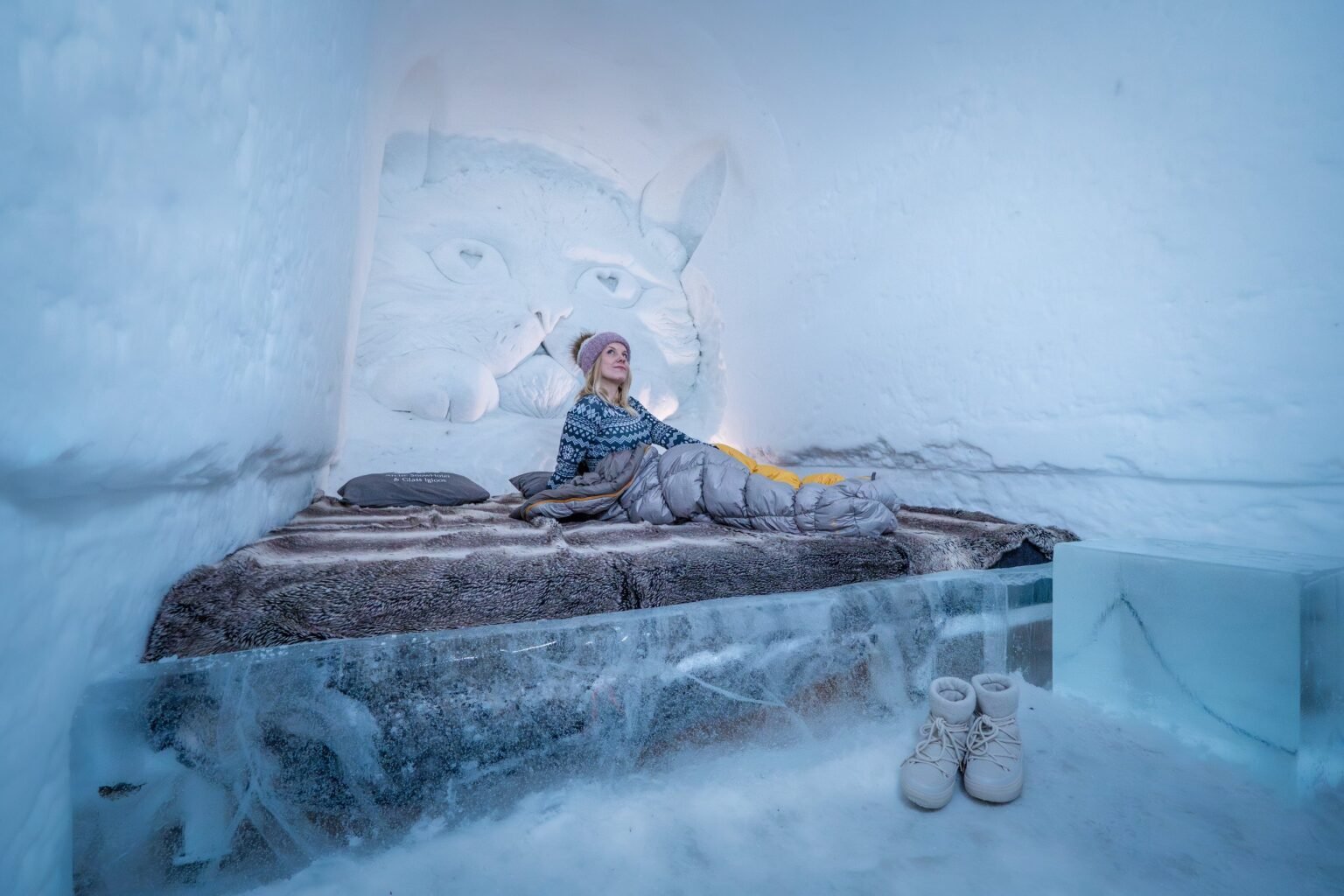 A room carved from snow, kept between 0 and −5 °C — Arctic SnowHotel & Glass Igloos, Sinettä, Rovaniemi
