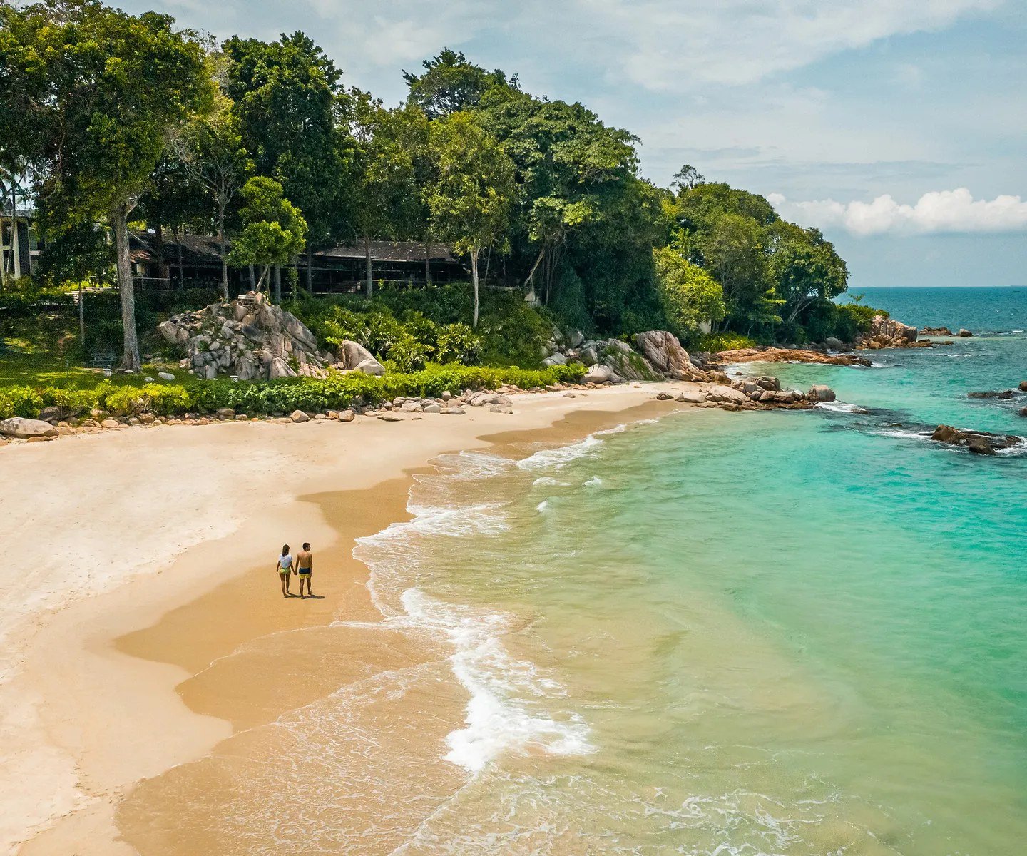 The beach and turquoise water of a sheltered cove, Club Med Bintan Island, Bintan Island, Indonesia