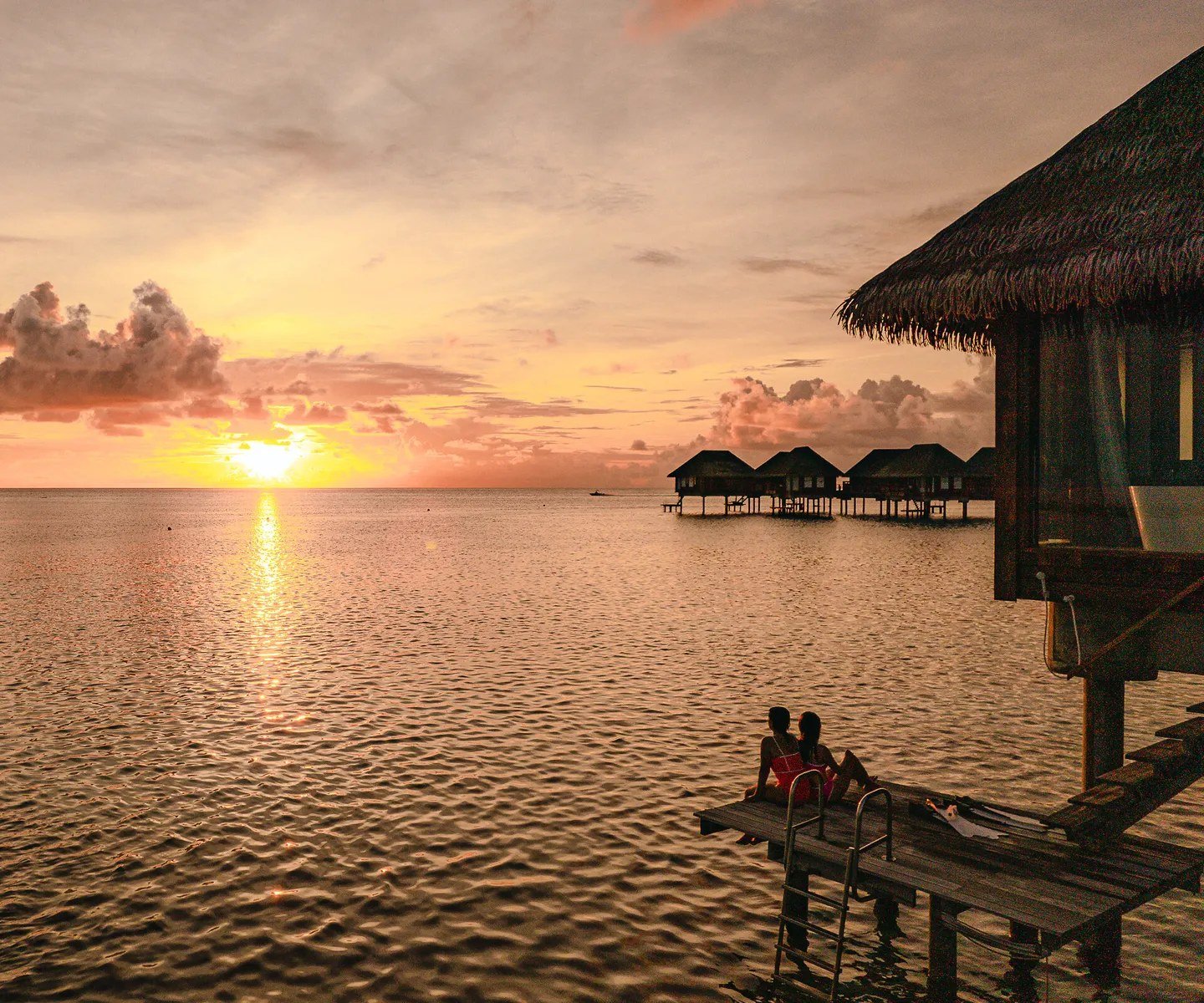 Sunset over the lagoon and the overwater suites, Club Med Kani, the Maldives