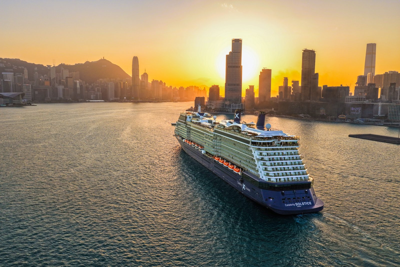 A Celebrity Cruises ship on Victoria Harbour at sunrise, Hong Kong
