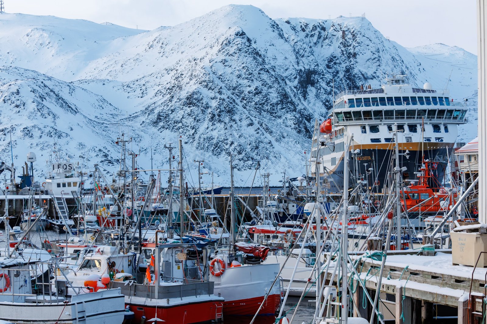 A Havila Voyages ship alongside the quay in a Norwegian fishing harbour