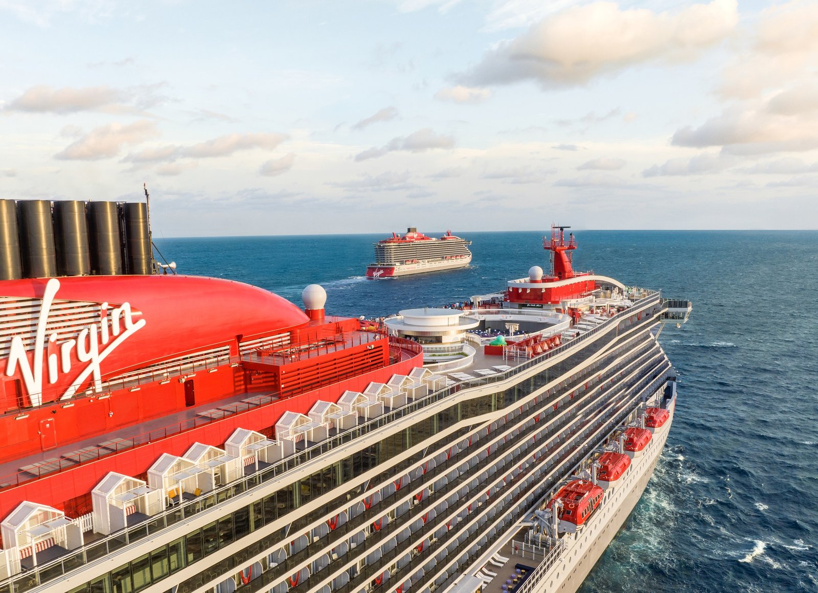 The funnel and upper decks of a Virgin Voyages ship