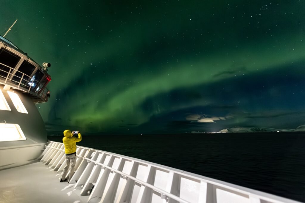 Watching the aurora from the open deck on the Norwegian coast