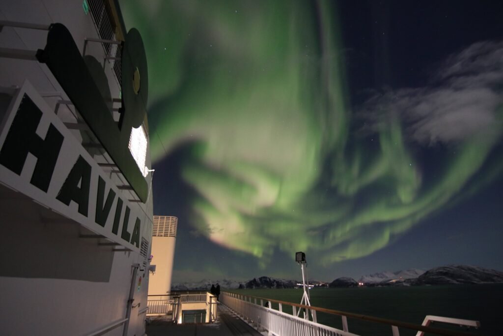 The aurora seen from the forward deck of a Havila ship