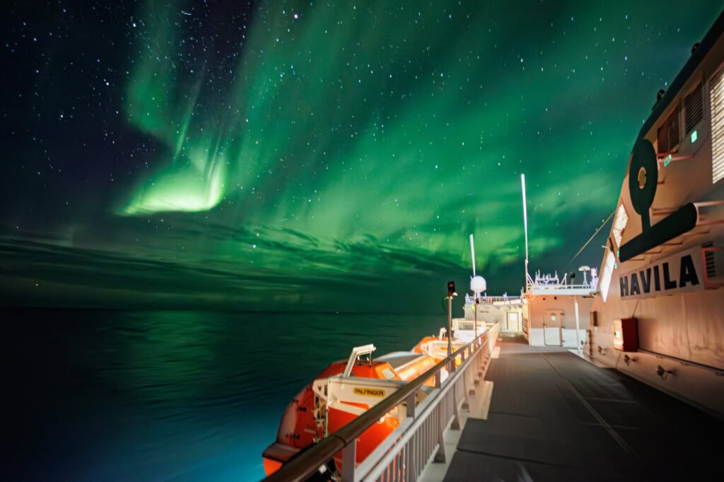 The northern lights above a Havila ship's superstructure