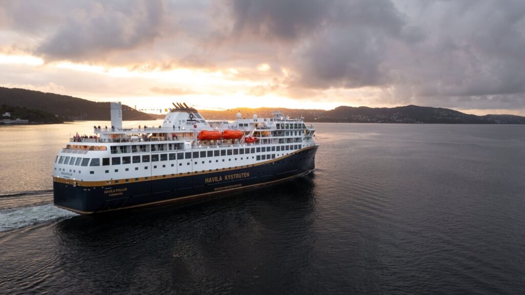 Havila Pollux at sunset, her name and home port of Fosnavåg on the stern