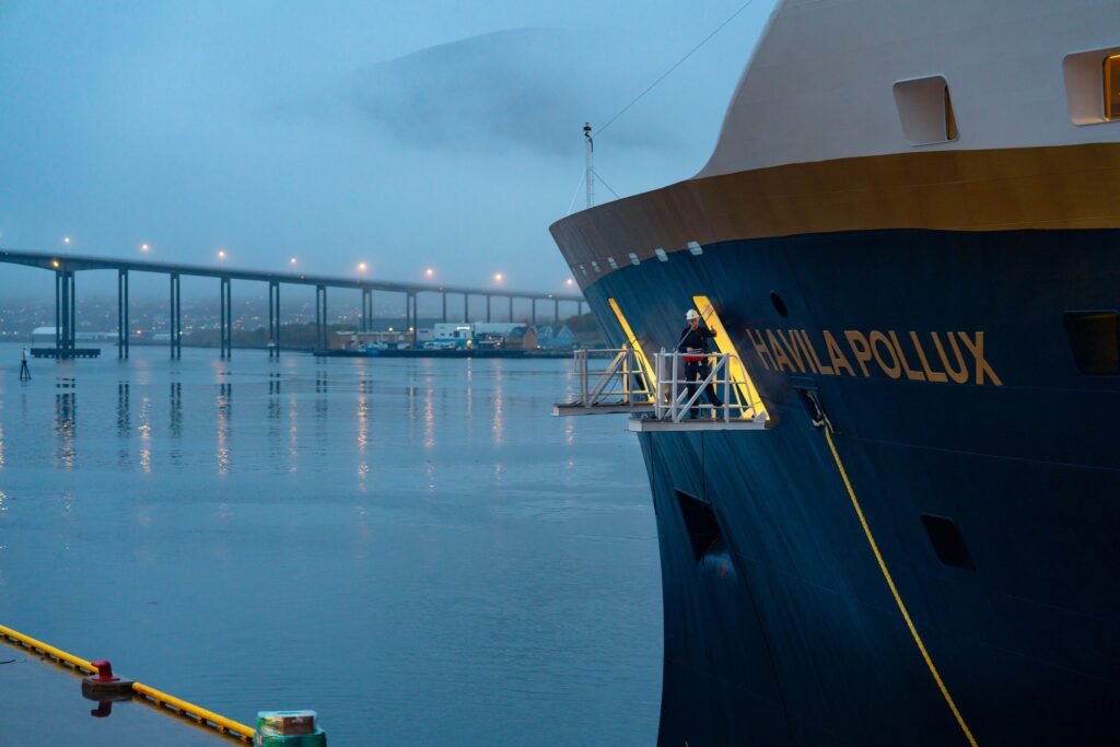 The bow of Havila Pollux at Tromsø, her name lettered large