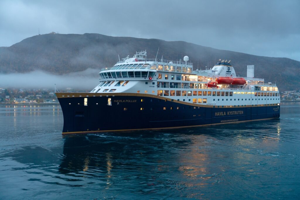 Havila Pollux lit up at Tromsø on an autumn evening