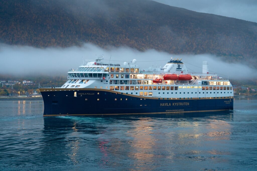 Havila Pollux under way off Tromsø at dusk