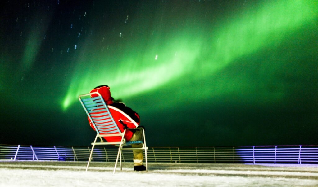 Watching for the northern lights from the deck on a winter sailing