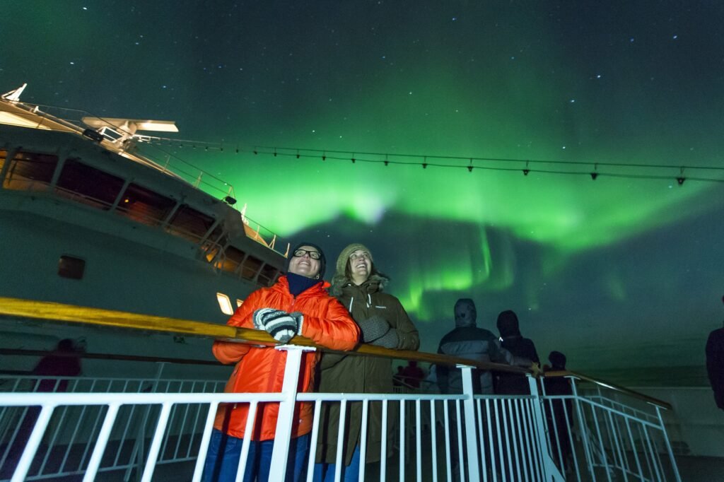 Aurora over the Norwegian coast on a winter voyage